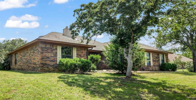 3502 Stage Coach Trl, Weatherford, TX 76087 - single story home with brick siding, a front lawn, and a chimney