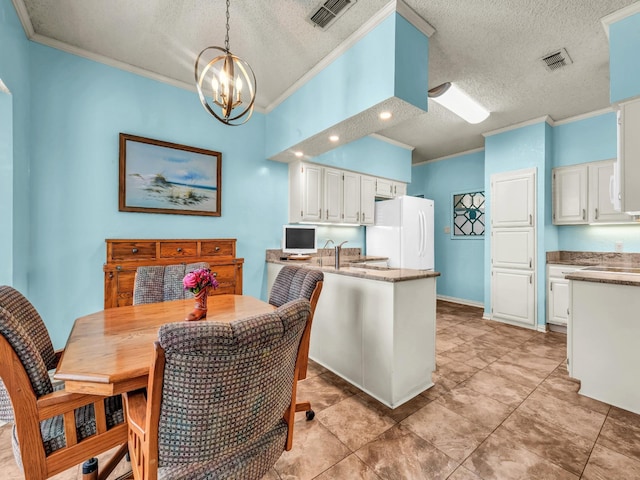 3502 Stage Coach Trl, Weatherford, TX 76087 - dining room with crown molding, a chandelier, a textured ceiling, light tile patterned floors, and recessed lighting
