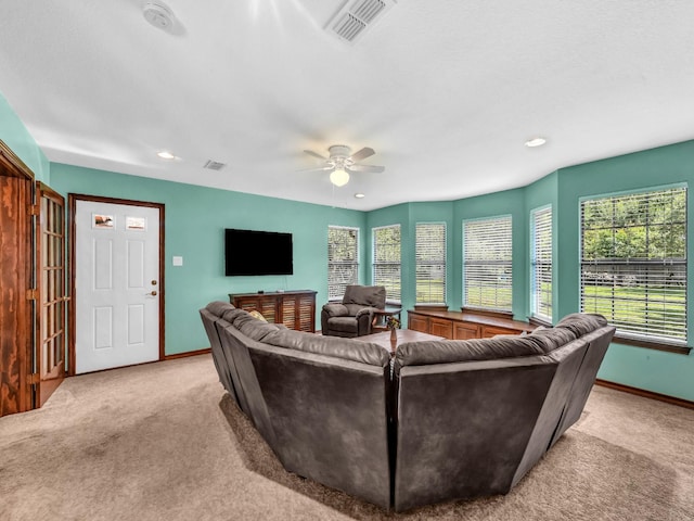 3502 Stage Coach Trl, Weatherford, TX 76087 - living room with light colored carpet, ceiling fan, plenty of natural light, and recessed lighting