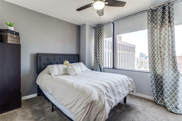 1200 Main St Unit 1402, Dallas, TX 75202 - carpeted bedroom featuring baseboards and a ceiling fan