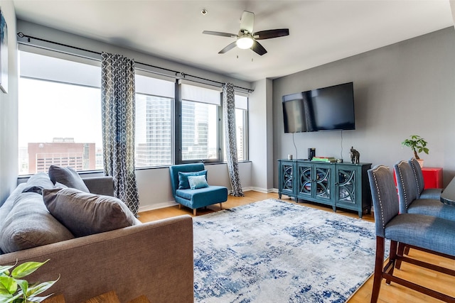 1200 Main St Unit 1402, Dallas, TX 75202 - living room featuring ceiling fan and wood finished floors