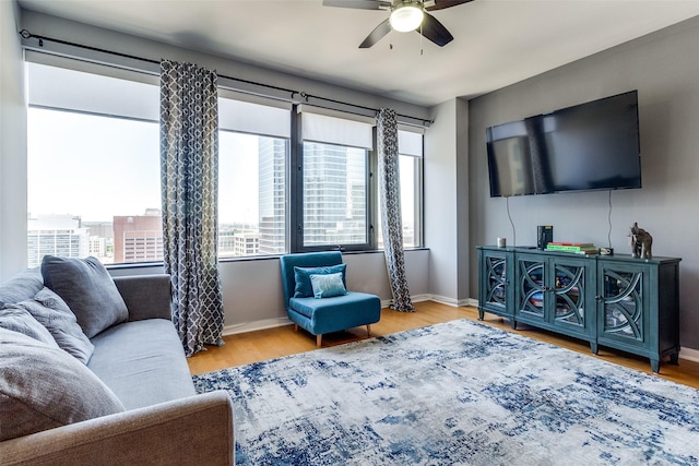 1200 Main St Unit 1402, Dallas, TX 75202 - living room with a ceiling fan, plenty of natural light, and wood finished floors
