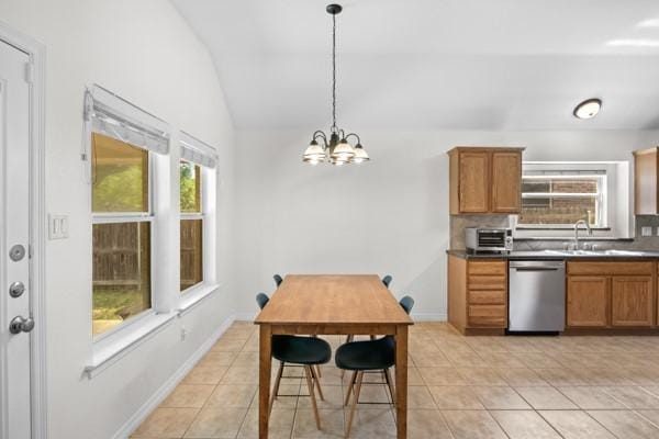 521 Willowview Dr, Saginaw, TX 76179 - kitchen with dishwasher, vaulted ceiling, light tile patterned floors, a chandelier, and plenty of natural light