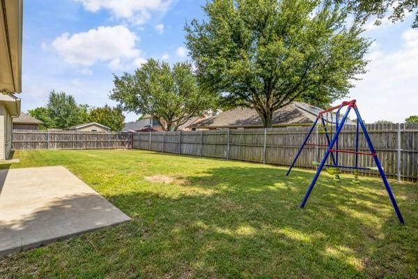 521 Willowview Dr, Saginaw, TX 76179 - fenced backyard featuring a patio area and a playground