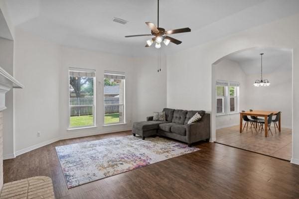 521 Willowview Dr, Saginaw, TX 76179 - living area with a ceiling fan, wood finished floors, arched walkways, a chandelier, and vaulted ceiling