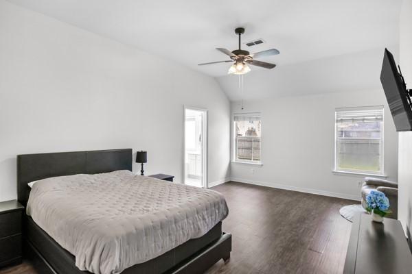 521 Willowview Dr, Saginaw, TX 76179 - bedroom with dark wood-style flooring, lofted ceiling, and a ceiling fan