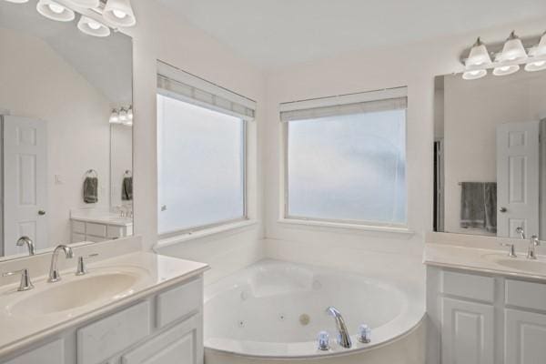 521 Willowview Dr, Saginaw, TX 76179 - full bathroom featuring two vanities and a jetted tub