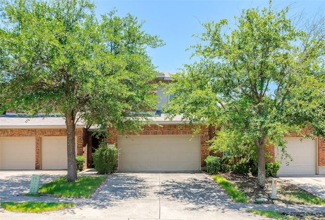 2142 Stonebrook Ln, Mesquite, TX 75181 - view of property hidden behind natural elements featuring driveway and brick siding