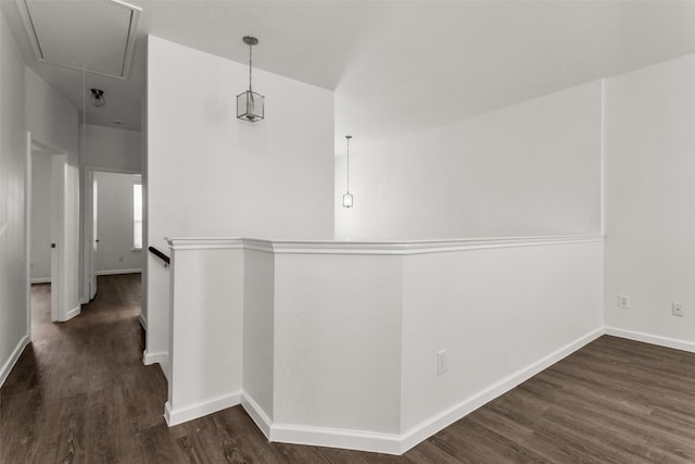 2142 Stonebrook Ln, Mesquite, TX 75181 - hallway featuring attic access, dark wood finished floors, and an upstairs landing