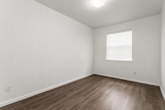 2142 Stonebrook Ln, Mesquite, TX 75181 - empty room featuring dark wood-style flooring and baseboards