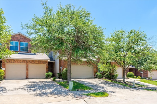 2142 Stonebrook Ln, Mesquite, TX 75181 - view of front of home featuring driveway, brick siding, and an attached garage
