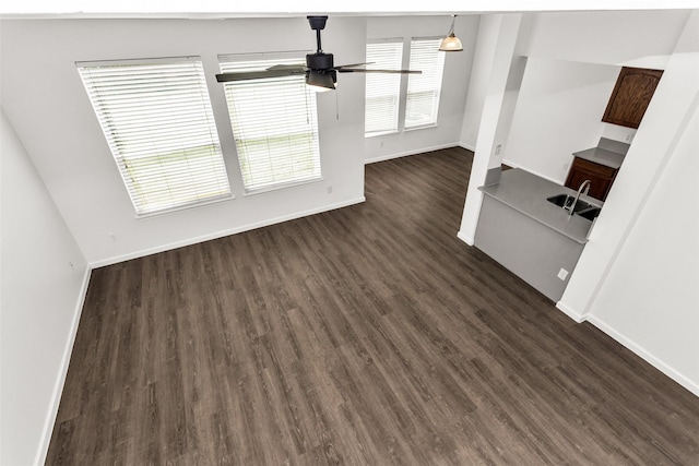 2142 Stonebrook Ln, Mesquite, TX 75181 - unfurnished living room featuring a ceiling fan and dark wood-style floors