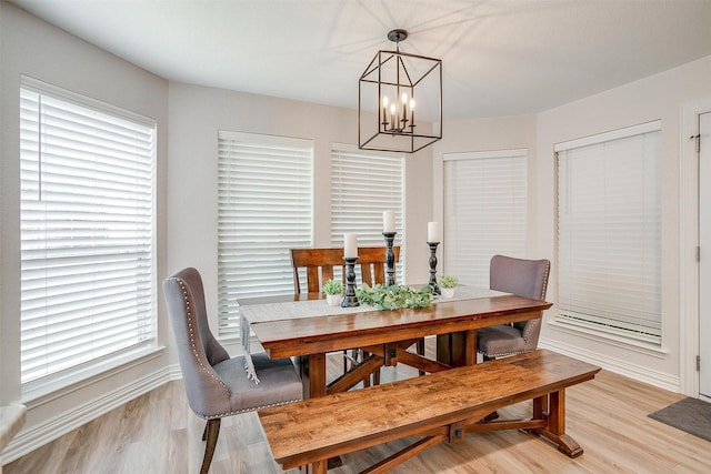 705 Tracy Dr, Azle, TX 76020 - dining room with a chandelier and light wood-style flooring