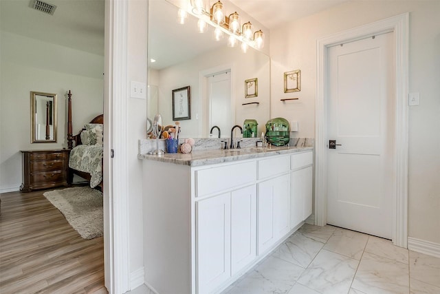 705 Tracy Dr, Azle, TX 76020 - ensuite bathroom featuring vanity and marble finish floors