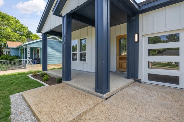 510 Woodrow Ave, Fort Worth, TX 76105 - view of exterior entry with board and batten siding and a porch