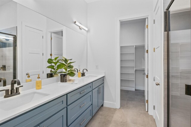 510 Woodrow Ave, Fort Worth, TX 76105 - full bath with a shower stall, double vanity, tile patterned floors, and a walk in closet