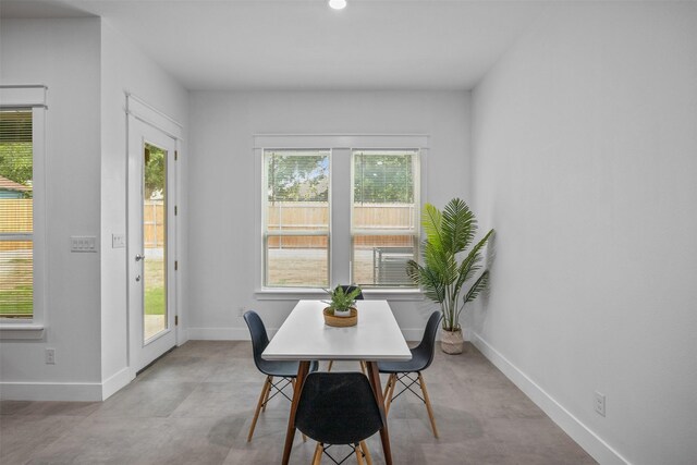 510 Woodrow Ave, Fort Worth, TX 76105 - dining space featuring finished concrete floors and baseboards