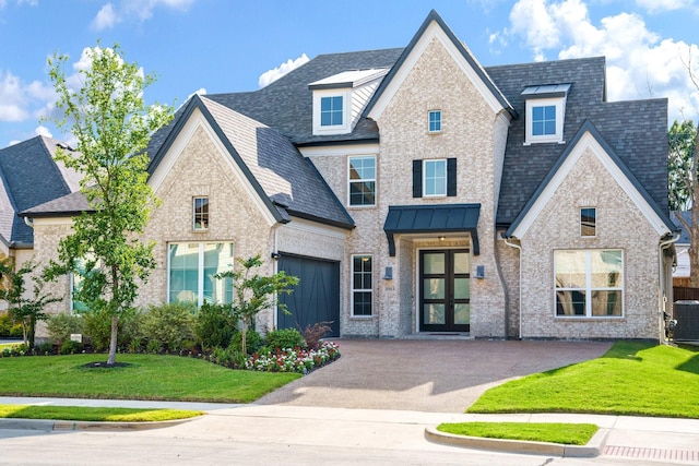 3915 Lochwood Dr, Rowlett, TX 75088 - view of front of house featuring concrete driveway, a shingled roof, and a front lawn