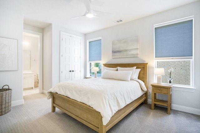 3915 Lochwood Dr, Rowlett, TX 75088 - carpeted bedroom with a closet, ensuite bath, and a ceiling fan