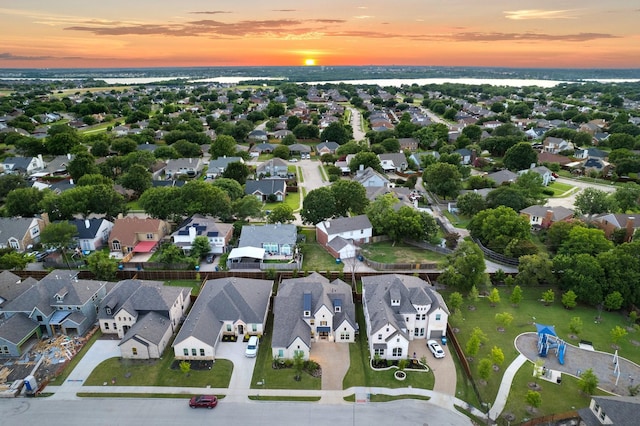 3915 Lochwood Dr, Rowlett, TX 75088 - aerial view at dusk of a residential view and a water view