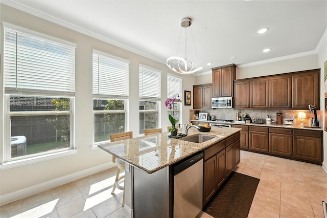 2711 Fleur De Lis Ln, Grand Prairie, TX 75054 - kitchen featuring appliances with stainless steel finishes, light tile patterned floors, tasteful backsplash, light stone countertops, and crown molding