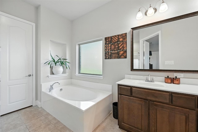 2711 Fleur De Lis Ln, Grand Prairie, TX 75054 - bathroom featuring vanity, a garden tub, and tile patterned floors