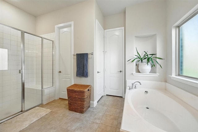 2711 Fleur De Lis Ln, Grand Prairie, TX 75054 - bathroom with a bath, a shower stall, and tile patterned floors