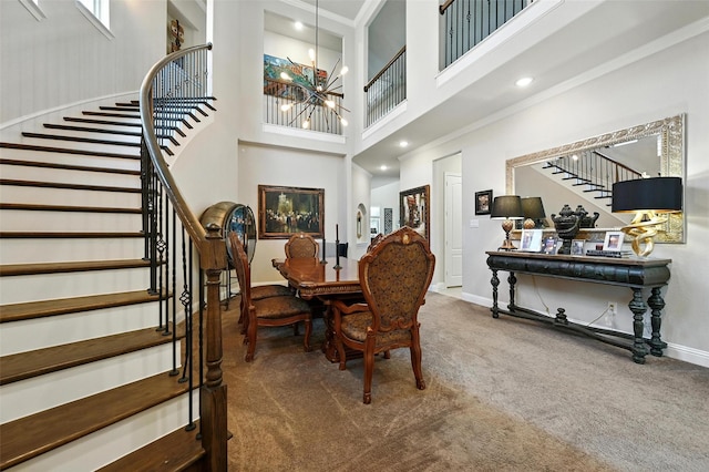 2711 Fleur De Lis Ln, Grand Prairie, TX 75054 - carpeted dining area featuring stairway, a chandelier, and a high ceiling