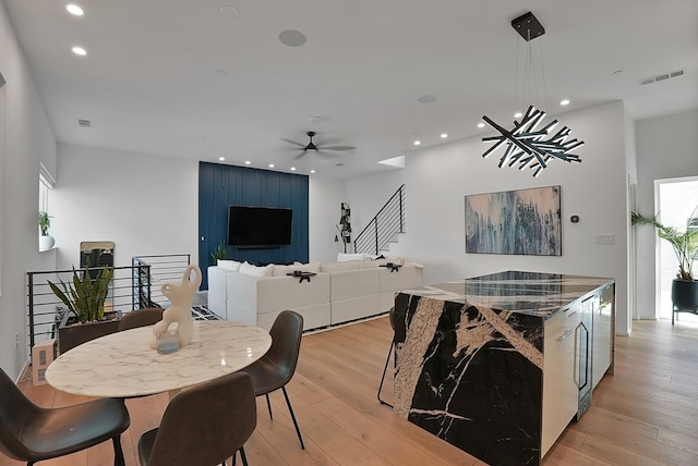 2001 N Prairie Ave Unit 106, Dallas, TX 75204 - dining area featuring light wood-type flooring, ceiling fan, and recessed lighting