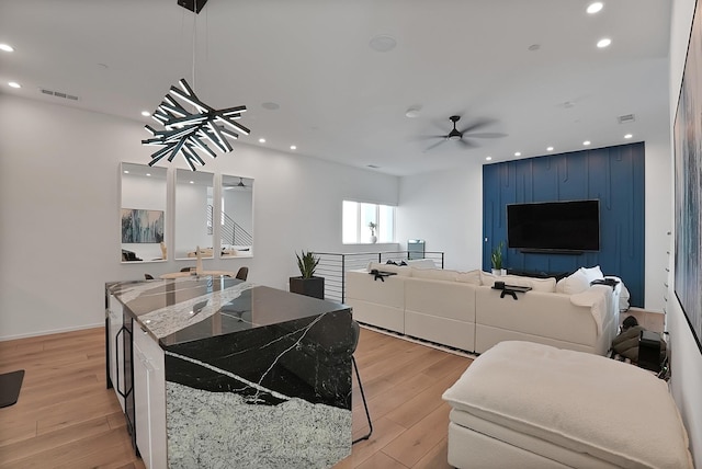 2001 N Prairie Ave Unit 106, Dallas, TX 75204 - living area with light wood finished floors, recessed lighting, and ceiling fan