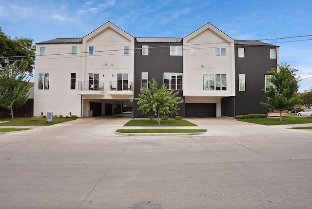 2001 N Prairie Ave Unit 106, Dallas, TX 75204 - view of property with an attached garage and driveway