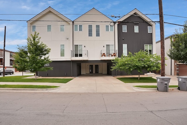 2001 N Prairie Ave Unit 106, Dallas, TX 75204 - view of front of house with a carport, french doors, and concrete driveway