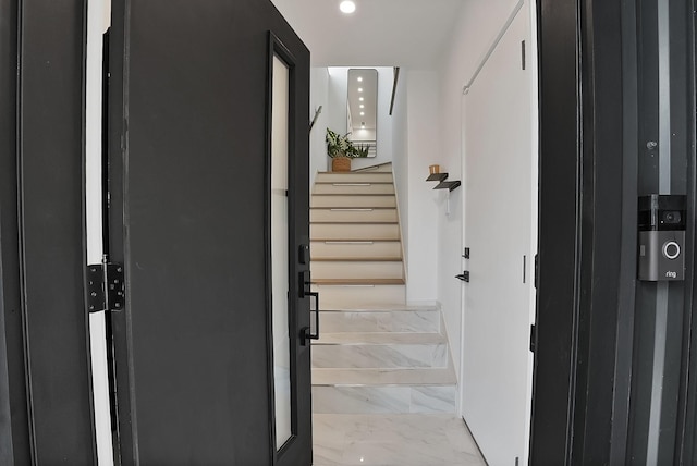 2001 N Prairie Ave Unit 106, Dallas, TX 75204 - corridor with marble tiled floors, stairs, and recessed lighting