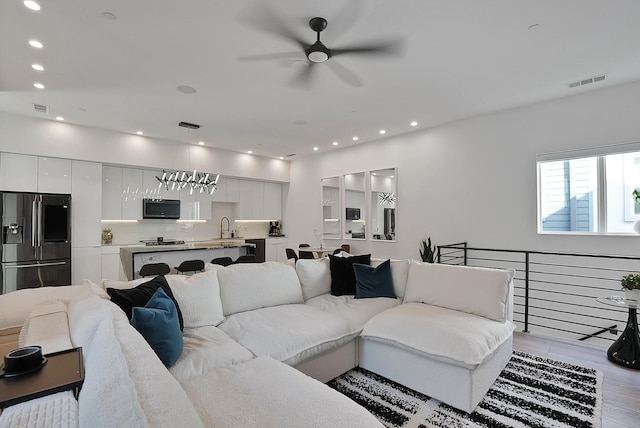 2001 N Prairie Ave Unit 106, Dallas, TX 75204 - living area featuring a ceiling fan, light wood-style flooring, and recessed lighting