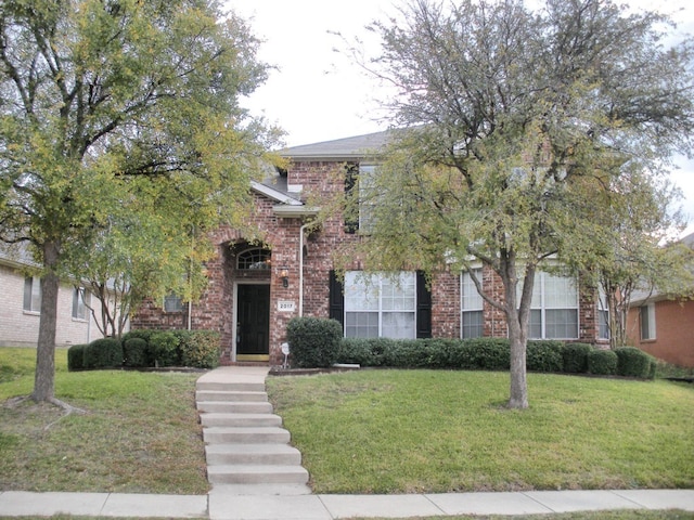 2017 Greenfield Ln, Allen, TX 75013 - view of property hidden behind natural elements with brick siding and a front yard