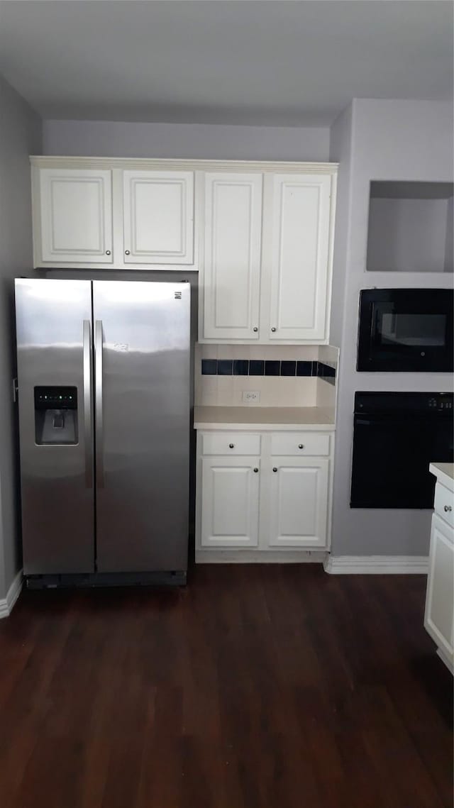 2017 Greenfield Ln, Allen, TX 75013 - kitchen featuring black appliances, light countertops, dark wood-style flooring, and white cabinets