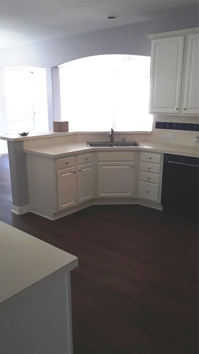 2017 Greenfield Ln, Allen, TX 75013 - kitchen featuring white cabinets, dark wood-style flooring, light countertops, and tasteful backsplash