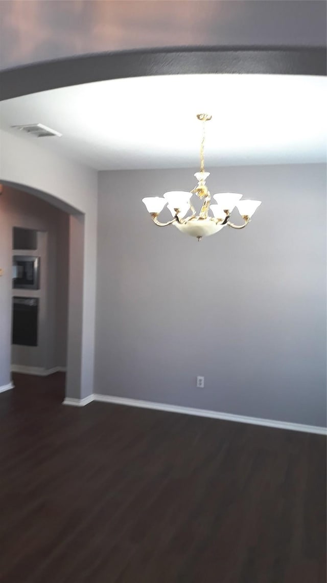 2017 Greenfield Ln, Allen, TX 75013 - empty room with a chandelier and dark wood-style floors