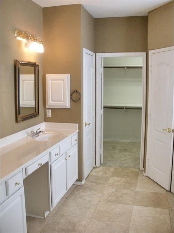 2017 Greenfield Ln, Allen, TX 75013 - bathroom with vanity and a walk in closet