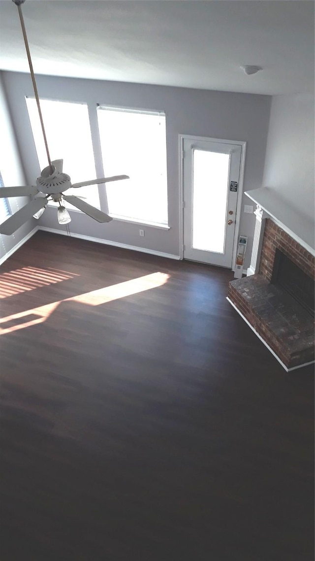 2017 Greenfield Ln, Allen, TX 75013 - unfurnished living room featuring ceiling fan, dark wood-style flooring, and a fireplace