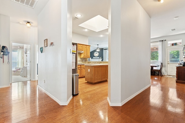 2020 El Camino Dr, Fort Worth, TX 76177 - hallway with light wood-style flooring, a skylight, and recessed lighting