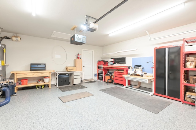 873 Mildren Ln, Fate, TX 75087 - garage featuring a workshop area and a garage door opener