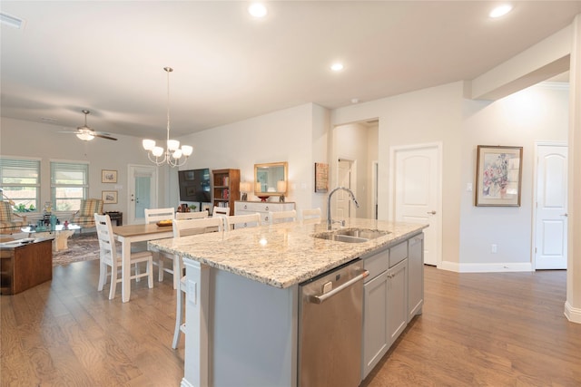 873 Mildren Ln, Fate, TX 75087 - kitchen featuring stainless steel dishwasher, wood finished floors, a kitchen island with sink, ceiling fan, and recessed lighting