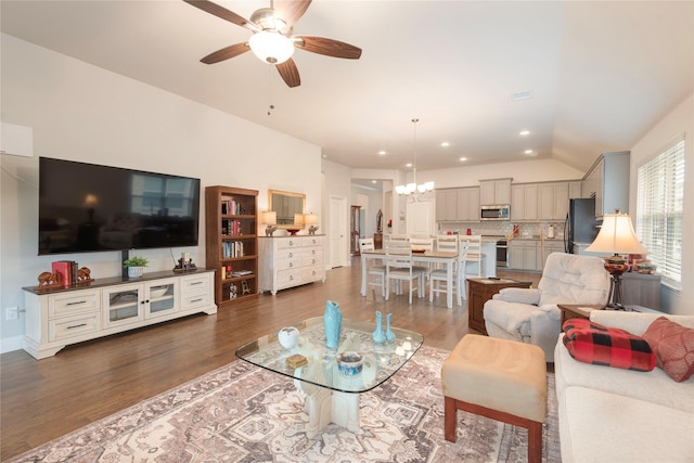 873 Mildren Ln, Fate, TX 75087 - living room featuring wood finished floors, a ceiling fan, a chandelier, lofted ceiling, and recessed lighting