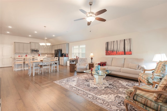873 Mildren Ln, Fate, TX 75087 - living room with a ceiling fan, a chandelier, wood finished floors, recessed lighting, and lofted ceiling