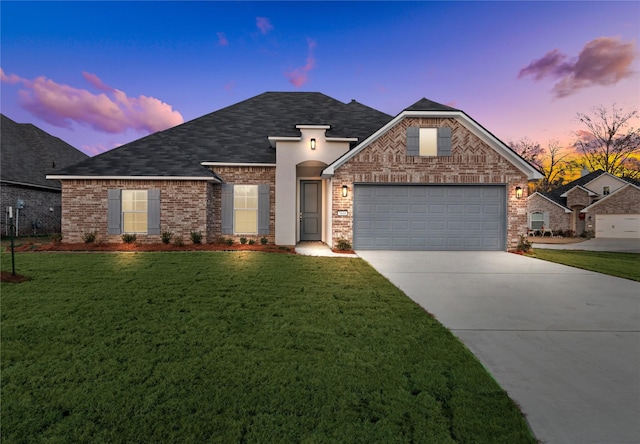 5608 Tall Pines Way, Shreveport, LA 71129 - french provincial home featuring an attached garage, concrete driveway, a yard, and a shingled roof