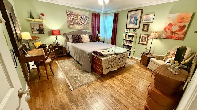 1705 14th St, Brownwood, TX 76801 - bedroom with light wood-style flooring and crown molding