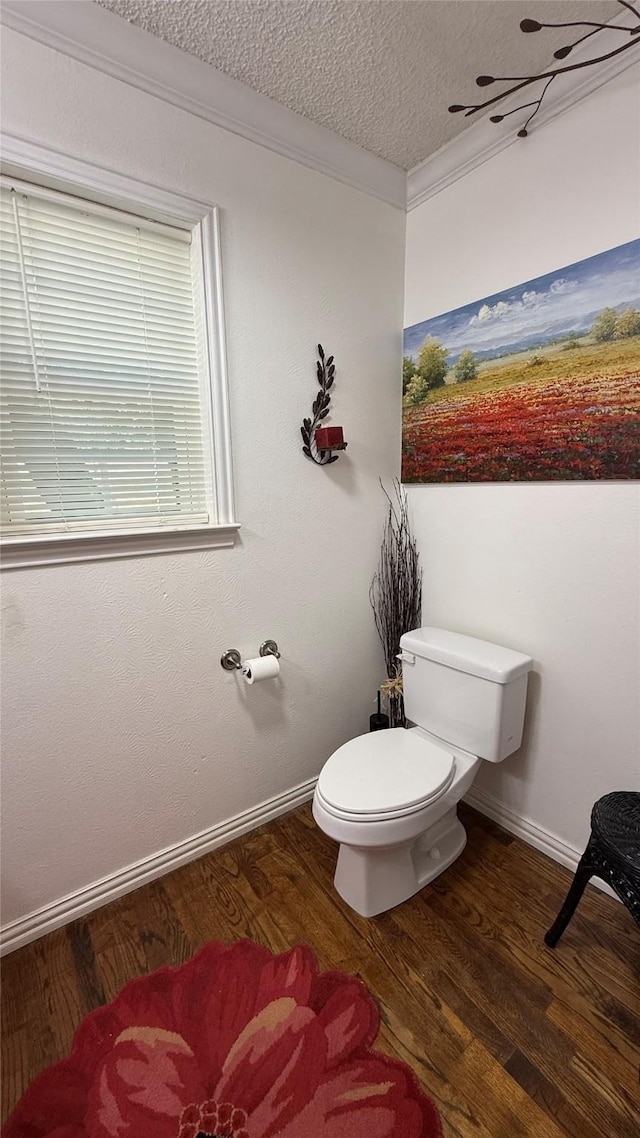 1705 14th St, Brownwood, TX 76801 - bathroom with wood finished floors, crown molding, and a textured ceiling