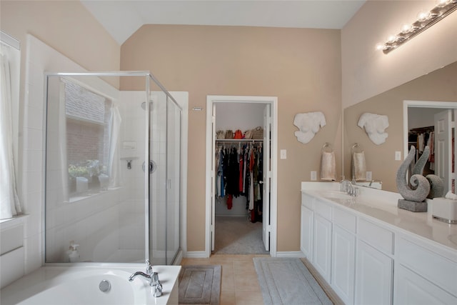 7585 Glasshouse Walk, Frisco, TX 75035 - full bath featuring a walk in closet, double vanity, a stall shower, tile patterned flooring, and a garden tub