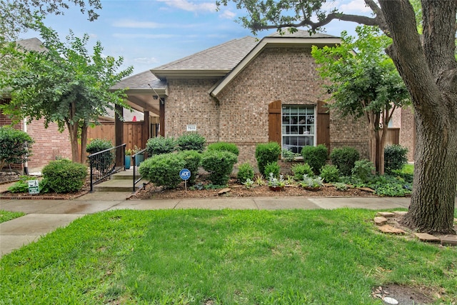 7585 Glasshouse Walk, Frisco, TX 75035 - view of front of home featuring brick siding and roof with shingles